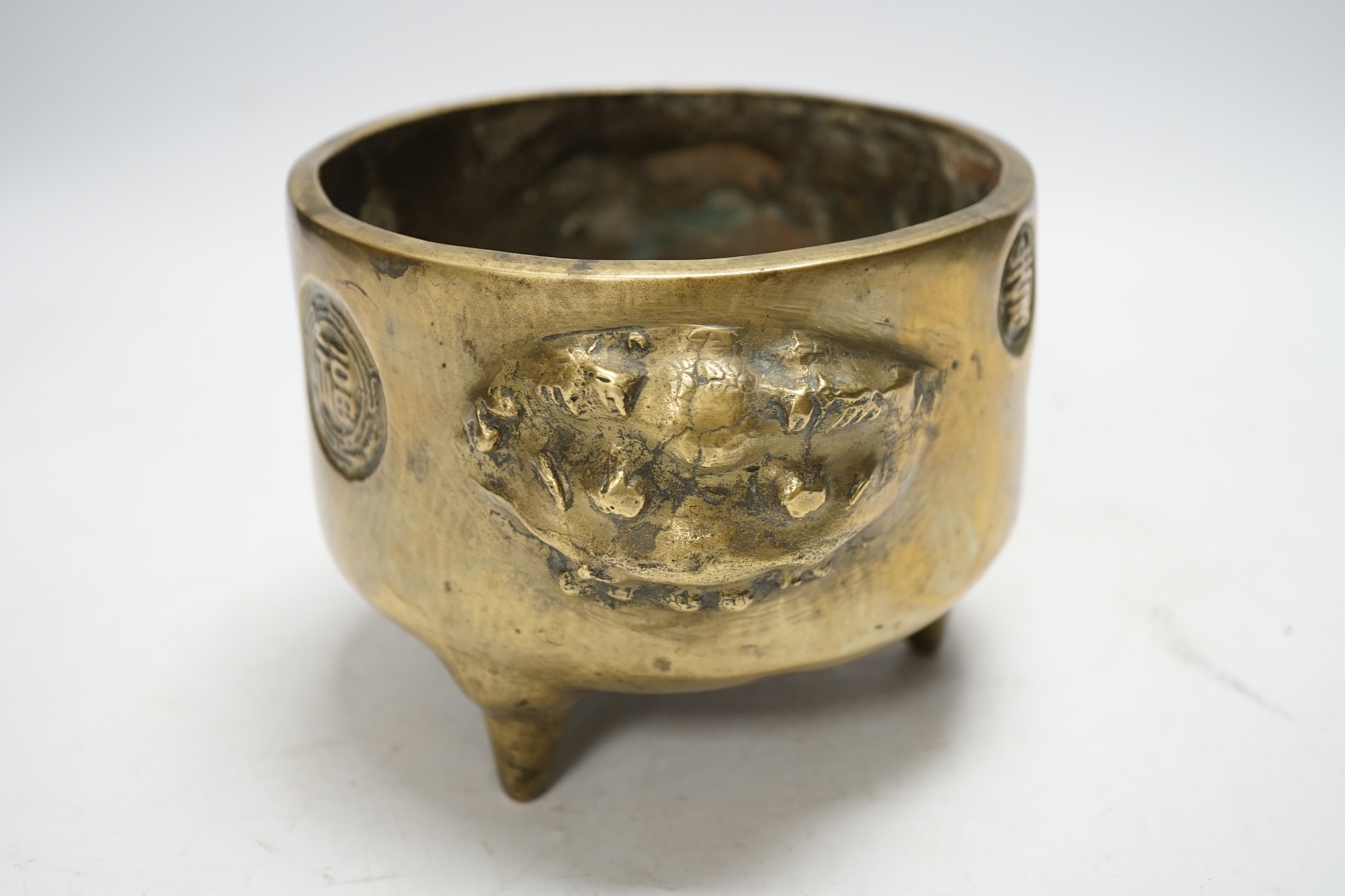 A Chinese bronze tripod censer, 18cm. Condition - fair to good